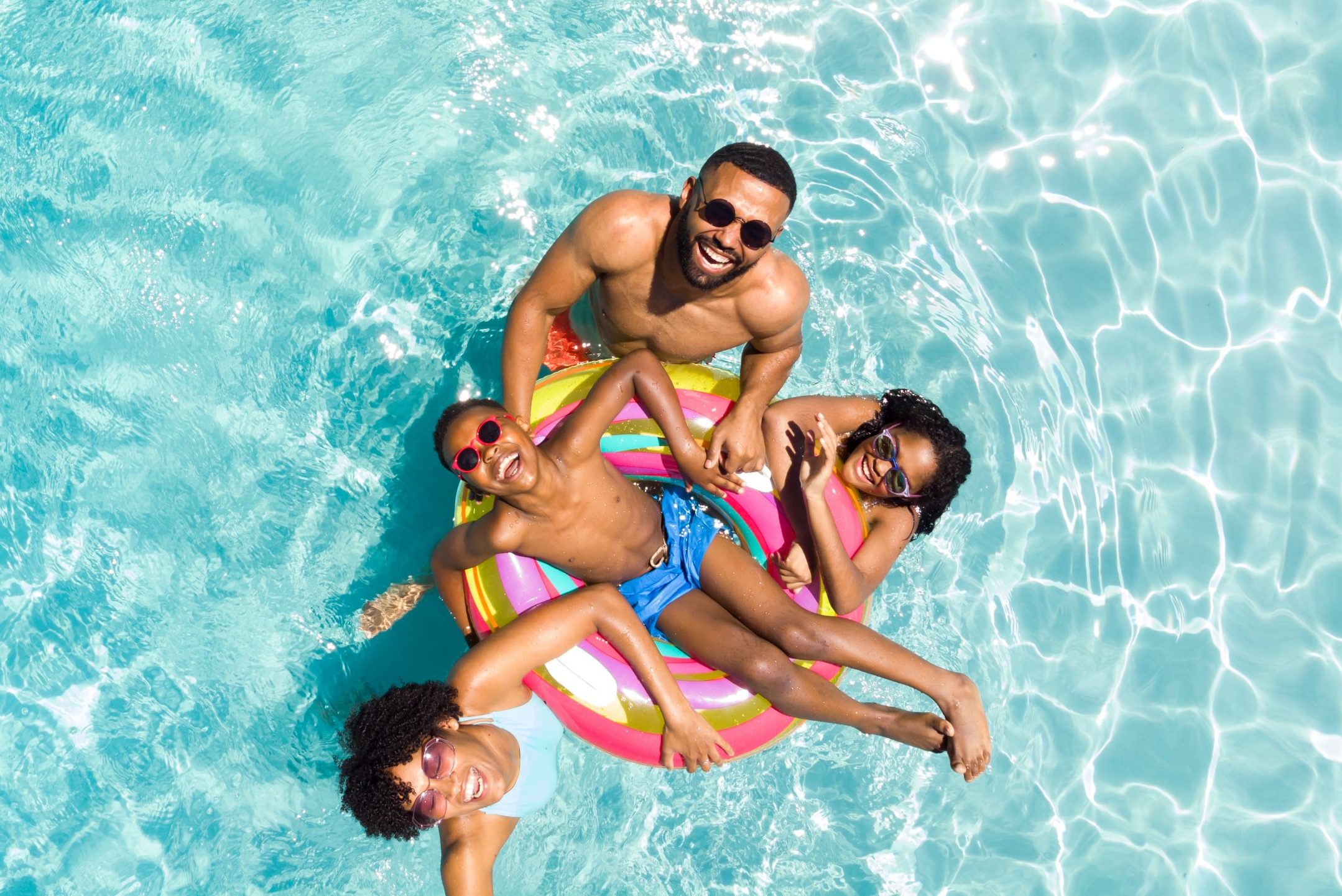 Family in a community swimming pool