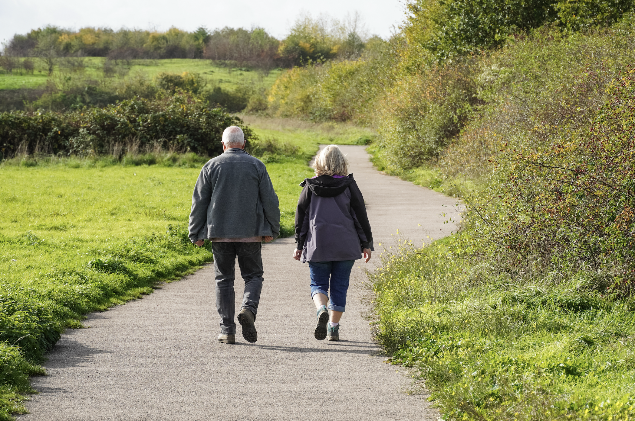 Couple walking on walking path