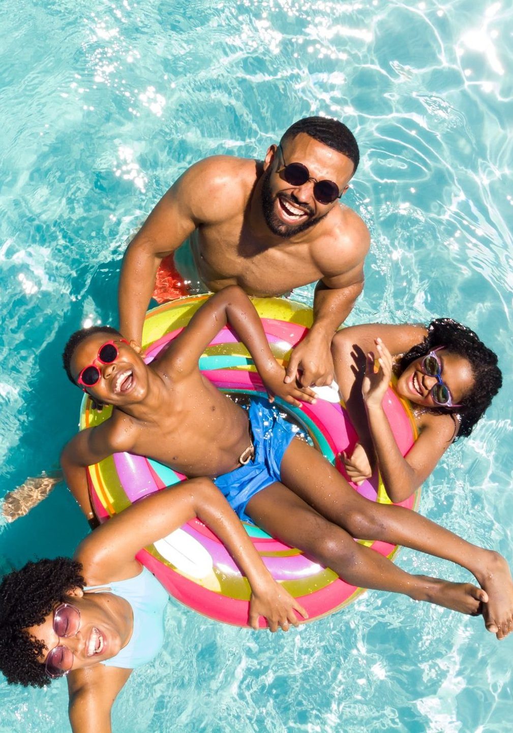 Family in a community swimming pool